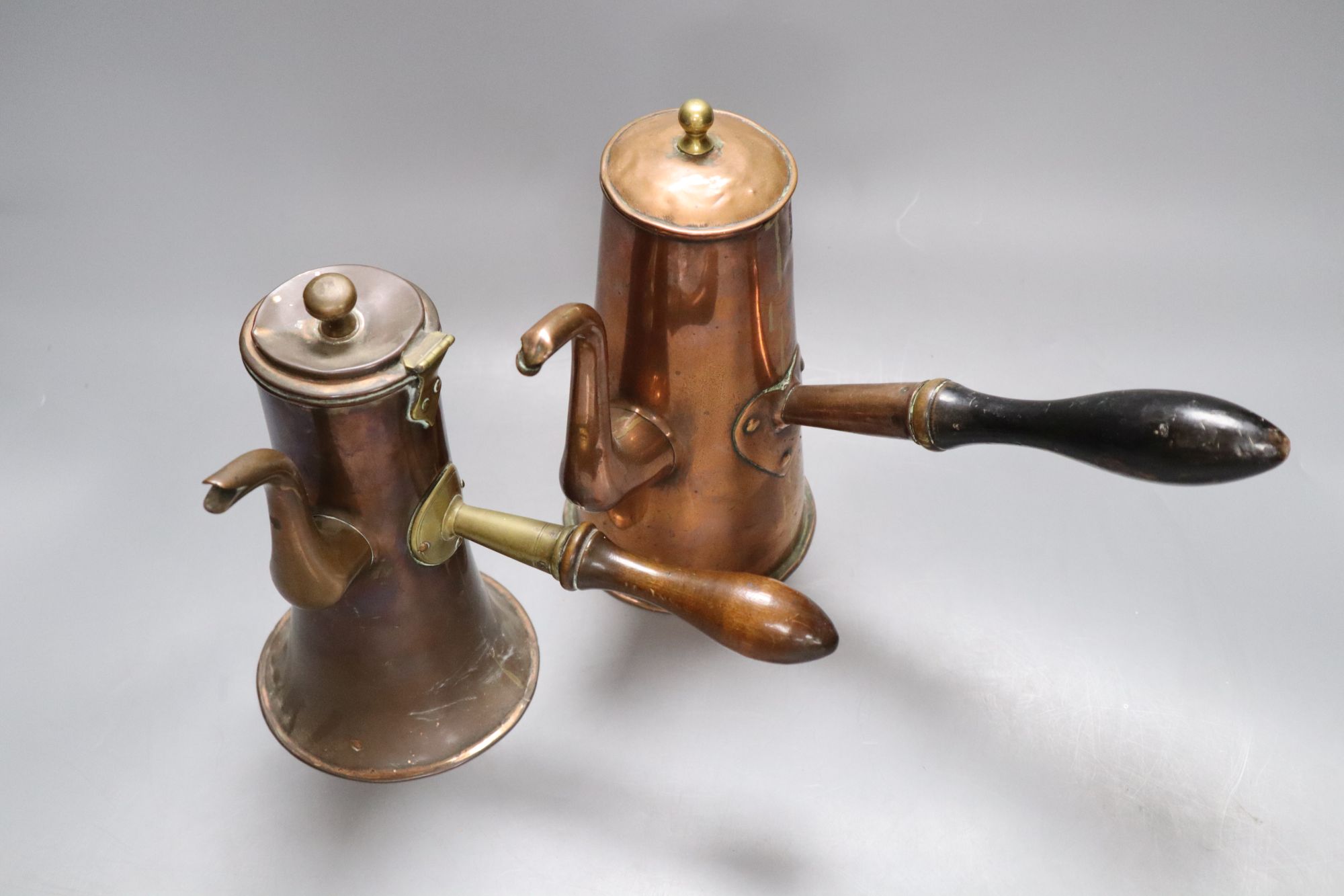 Two 18th century copper Tavern coffee pots, tallest 20cm